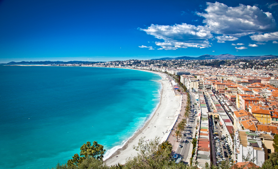 Panoramic view of Nice coastline and beach with blue sky, France.