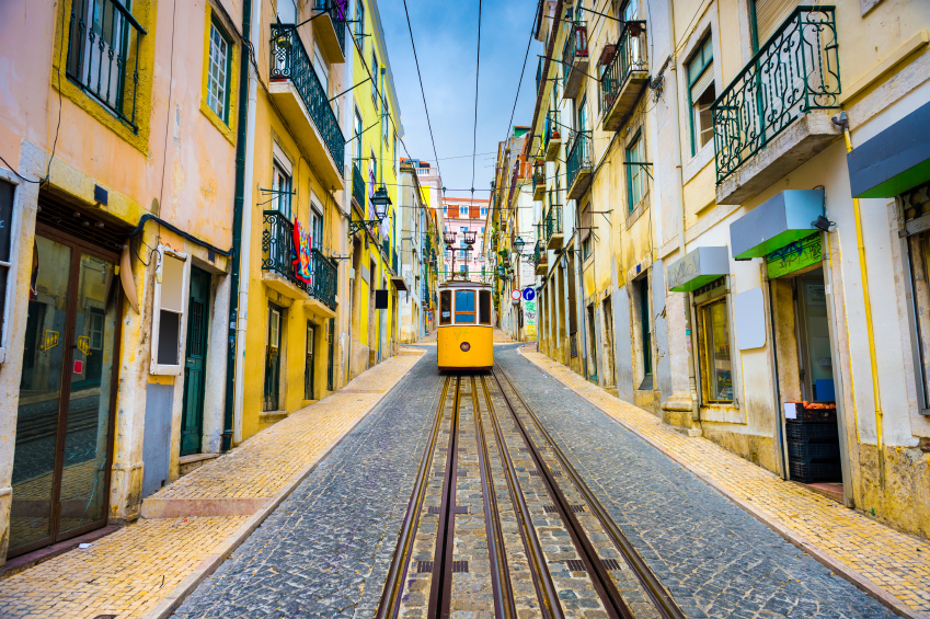 Lisbon, Portugal old town streets and street car.