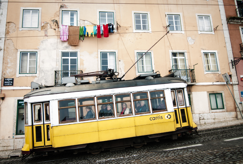 Old tram and clothslines in Alfama, Lisbon