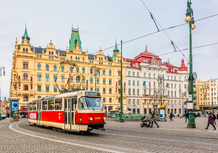 PRAGUE,CZECH REPUBLIC - January 15,2015: One of the symbol of Prague; a tram - street car turning in Old Town (Staré Město) by Náměstí Republiky station