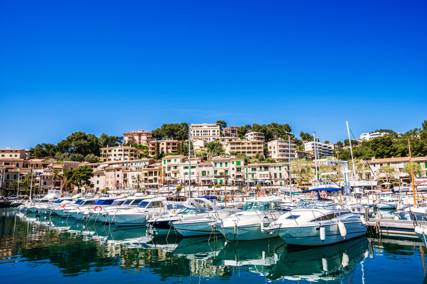 Yachts and boats in the harbour of the lively resort town of Port de Soller, Majorca (Spain)