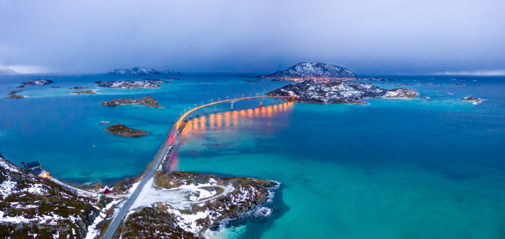 Aerial view of Sommaroy bridge and island at dusk, Troms County, Norway